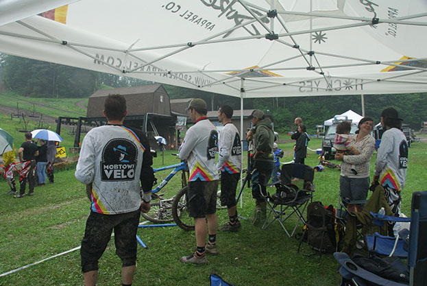 Watching race runs in the pouring rain.