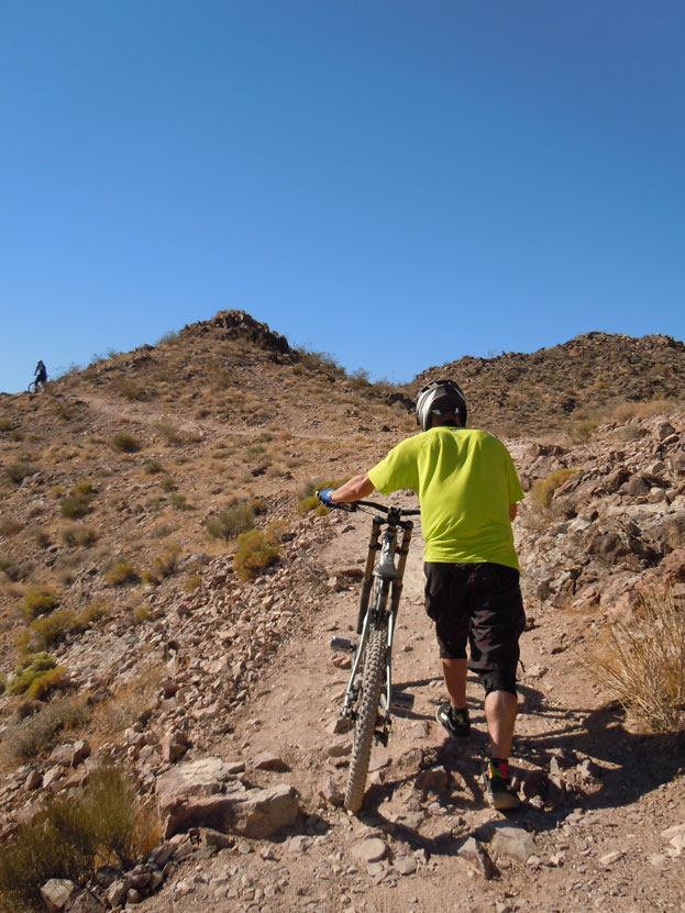 dirt_demo_hike_bikes Hiking Bikes Up to the DH Trail Head